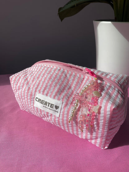 Trousse rose clair à rayures