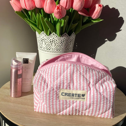 Trousse rose clair à rayures